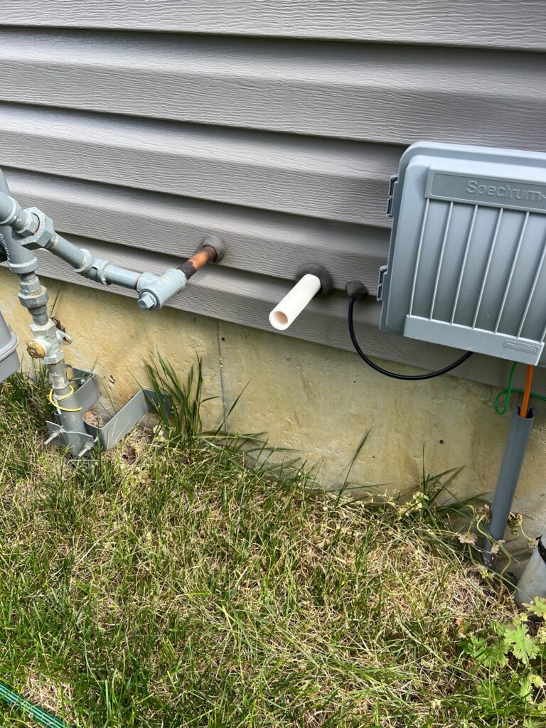 sump pump discharging next to home